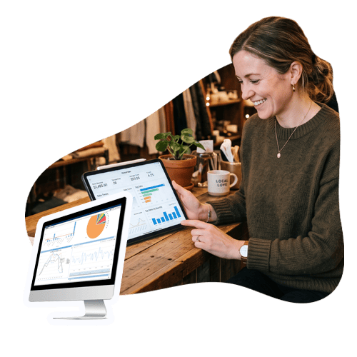 DBS Reporting & Analytics for Retail Businesses A woman checks her reporting on an iPad.