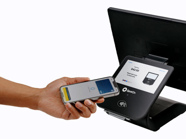 Modern POS system with contactless payment terminal and monitor.