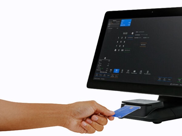 Point of sale system with card payment terminal and touchscreen display.