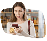 Woman making a mobile payment with her smartphone at a retail store.