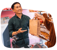 Customer receiving receipt at retail checkout.