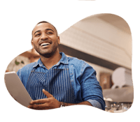 Happy man using a POS system in multi-location environment.