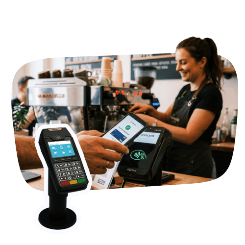 A man makes a payment with his phone at a payment terminal.
